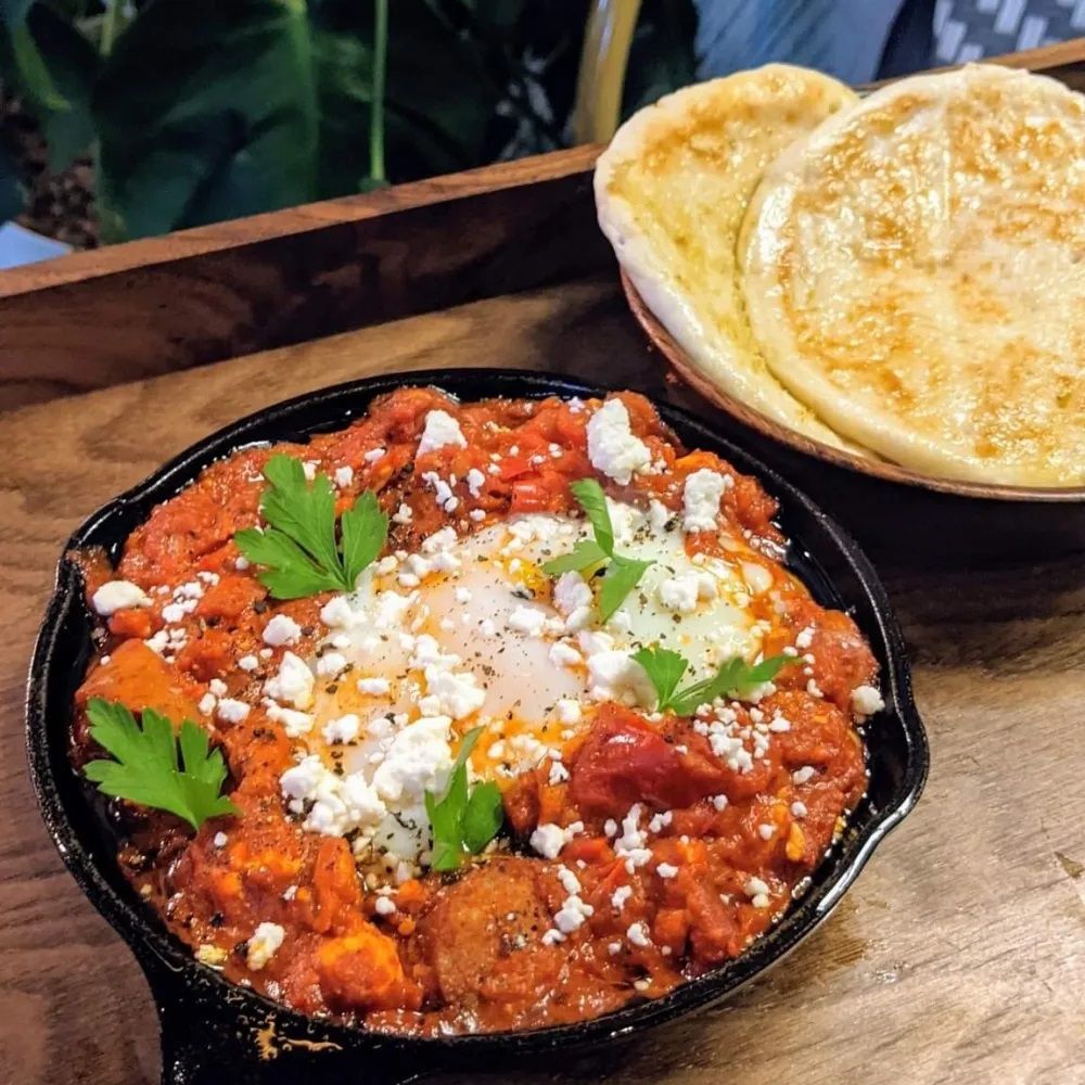 Spicy Shakshuka with Two Garlic Pita Grain Alley Menu