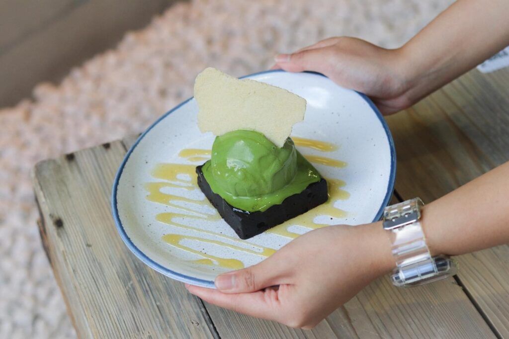 Brownie topped with Matcha Gelato